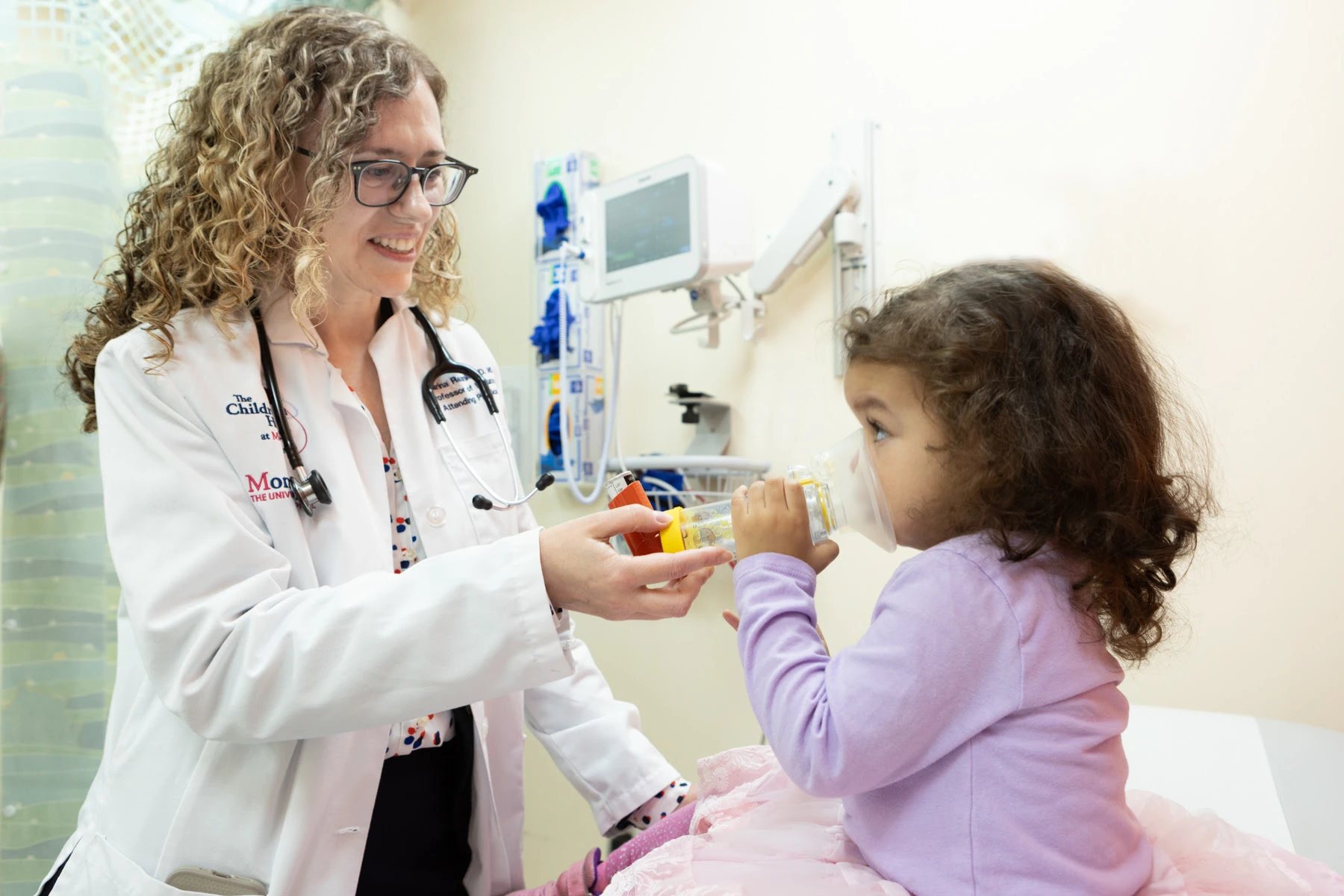 Dr. Reznik providing asthma care at the Children's Hospital at Montefiore - from PRNewswire